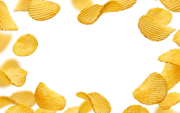 istock Frame of ridged potato chips isolated on white background 1358139964