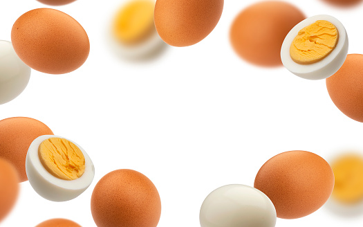 Frame of hard boiled chicken eggs isolated on white background with clipping path