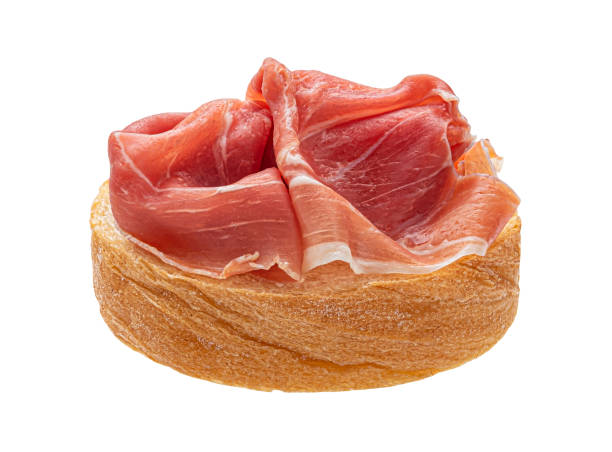 istock Toast with prosciutto isolated on white background 1358140581