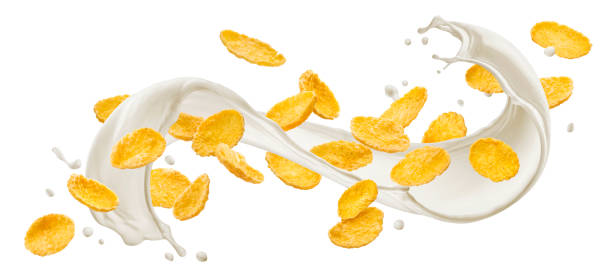 istock Corn flakes with milk splash isolated on white background 1358140614