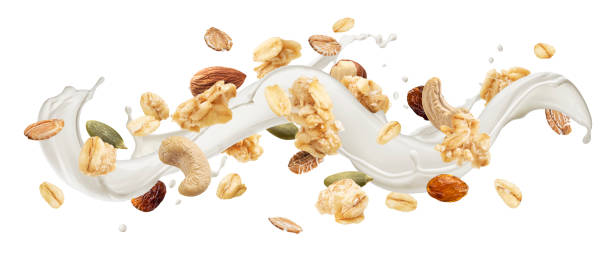 istock Granola with milk splash isolated on white background 1358140615