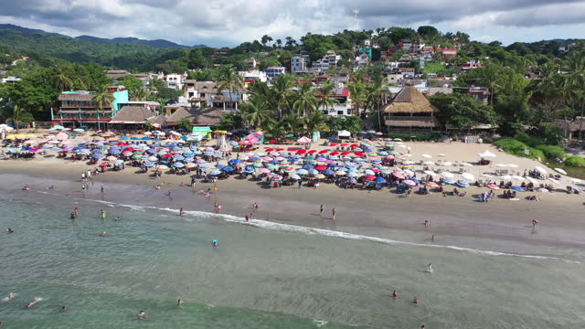Drone shot of cityscape of Puerto Vallarta. Turquoise water and public beach