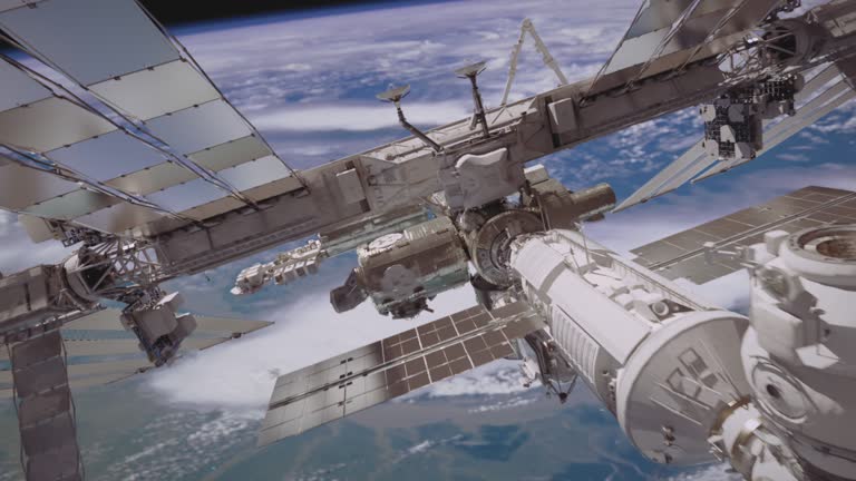 International Space Station ISS flying over earth atmosphere.