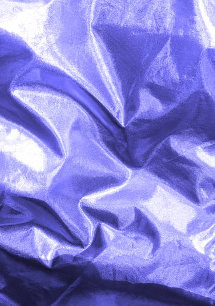 istock Blurred holographic foil texture in trendy very peri color 1358145377
