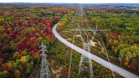 Aerial view.  High-voltage towers in the forest.