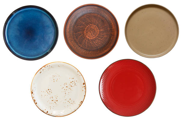 istock clean empty handmade ceramic plate isolated on white background, food dishes for cut out and design, copy space and mock up template 1358146538