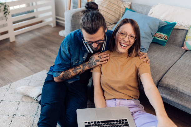 istock Young couple working together from home 1358146859