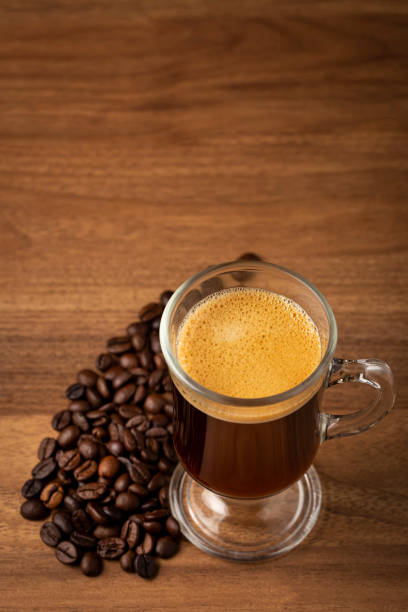 istock Espresso and coffee beans on the table. 1358148606
