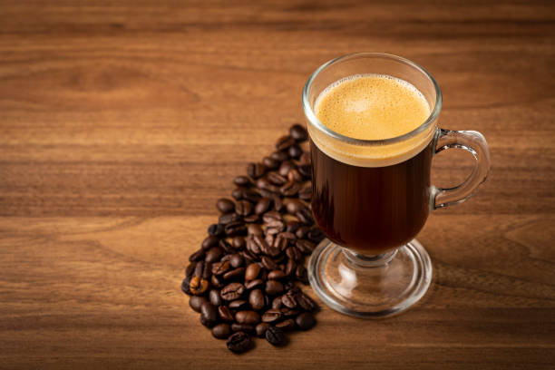 istock Espresso and coffee beans on the table. 1358148609
