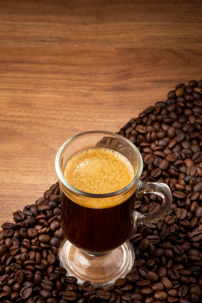 istock Espresso and coffee beans on the table. 1358148677