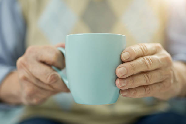 istock Aged man resting at home with a cup of hot drink 1358152655