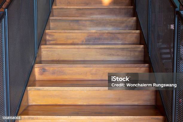 Perspective View Of Wooden Stairway With Urban Style Decoration Of Railing And Brick Wall Shows Beautiful Backdrop And Background For Retro And Vintage Concept Store Shop Or House Stock Photo - Download Image Now