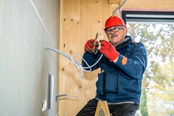 istock Electrician preparing cables for connecting 1358161793