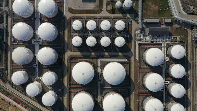 Real Time / Aerial View Of A Liquefied Natural Gas (LNG) Tanker Moored To The Jetty