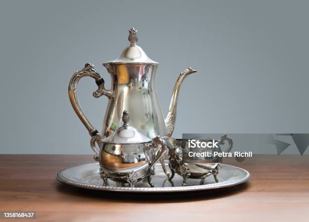Ornate 4piece Tea Set On Table Stock Photo - Download Image Now - Silver - Metal, Silver Colored, Afternoon Tea