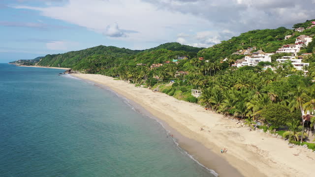 Drone shot of cityscape of Puerto Vallarta. Turquoise water and public beach