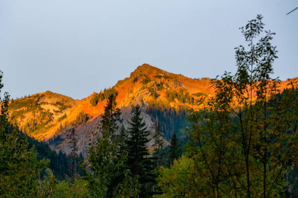 istock Orange Alpenglow at Sunrise on Mountain Ridge in the Fall 1358171794
