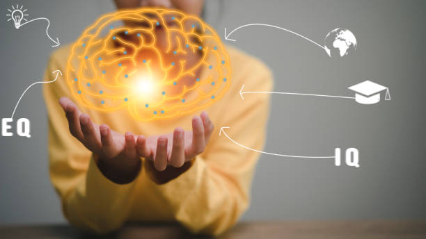 istock little girl's hands holding the brain.for development ahead tiny person concept. Progress direction with a future vision. 1358178364