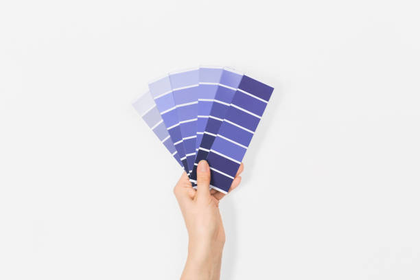 Color swatches with color of the year 2022 in the hand - Very Peri. Color trend palette. Top view, flat lay. Color swatches with color of the year 2022 in the hand - Very Peri. Color trend palette. Top view, flat lay. cscs stock pictures, royalty-free photos & images
