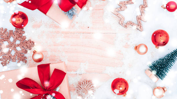 istock Xmas background table. Winter wooden decoration backdrop. Christmas board with old rustic wall, white frozen snow, golden balls and gift box. Minimal flat lay. 1358182823
