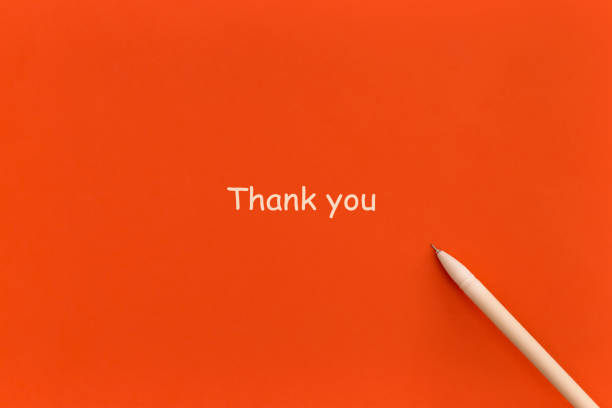 istock Pen on red background with words Thank you. Top view. Flat lay. 1358183499