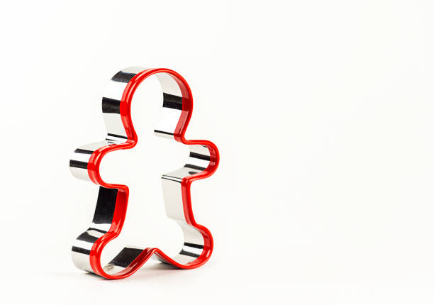 istock Gingerbread man shape on white background. Concept of Christmas. 1358187319