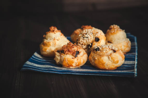 istock puff buns with raisins on a blue background 1358188062