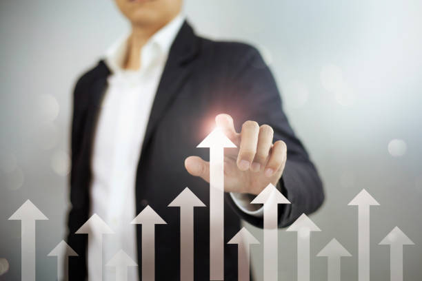istock Businessman pointing arrow graph corporate future growth plan 1358188207