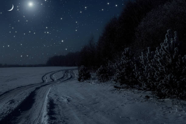 The moon in the sky and the stars at night