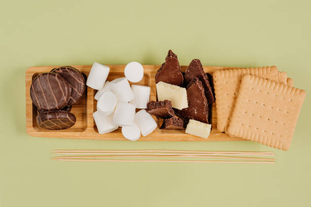 istock S'mores roasting marshmallows with chocolate between cookies 1358191201
