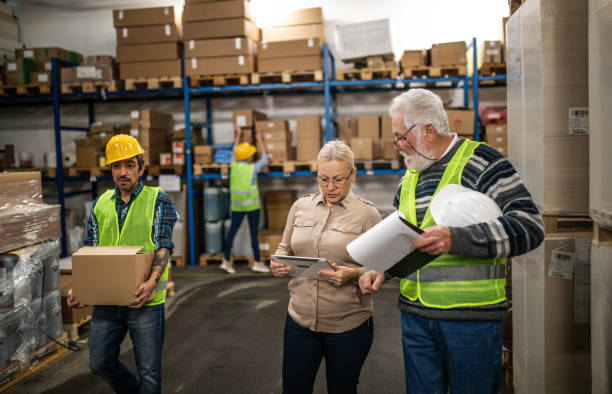 istock Group of workers working in a warehouse 1358194185