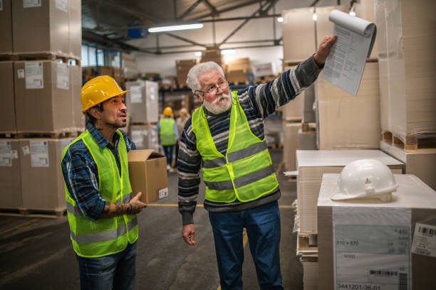 istock Group of workers working in a warehouse 1358194226