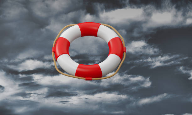 istock Lifebuoy coming from the dark clouds. 1358196385