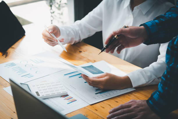 istock Businessman analyzing investment charts. Accounting 1358196397
