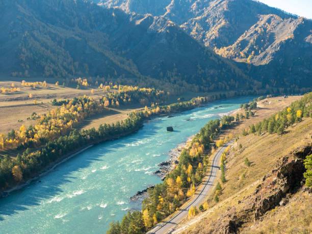 Autumn view of the turquoise Katun river and Altai mountains. Che-Chkysh, Altai Republic, Russia Autumn view of the turquoise Katun river and Altai mountains. Che-Chkysh, Altai Republic, Russia. western siberia stock pictures, royalty-free photos & images