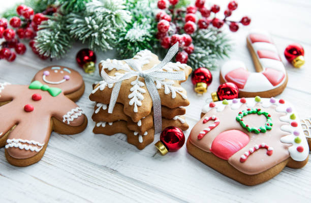 istock Christmas gingerbread with christmas decorations on white wooden 1358197943