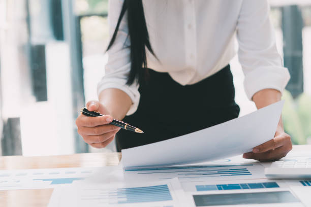 istock Financial inspector calculating a numbers in office room. 1358198668