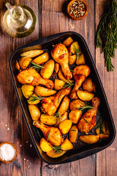 istock Roasted chicken legs with potatoes and rosemary. 1358198894