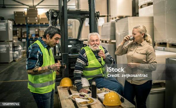 Warehouse Worker Relaxing And Eating Lunch Stock Photo - Download Image Now - Occupation, Working, Taking A Break