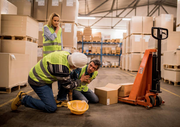 istock Warehouse worker after an accident in a warehouse 1358200698