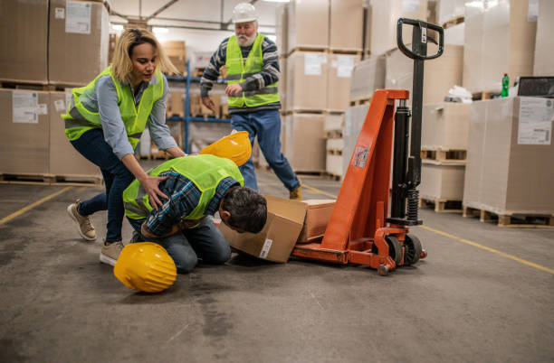 istock Warehouse worker after an accident in a warehouse 1358200854