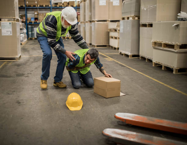 istock Warehouse worker after an accident in a warehouse 1358200867