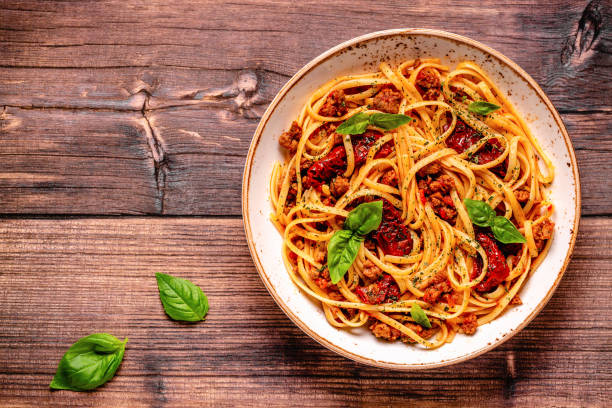 istock Pasta with bolognese sauce and sun-dried tomatoes 1358202369