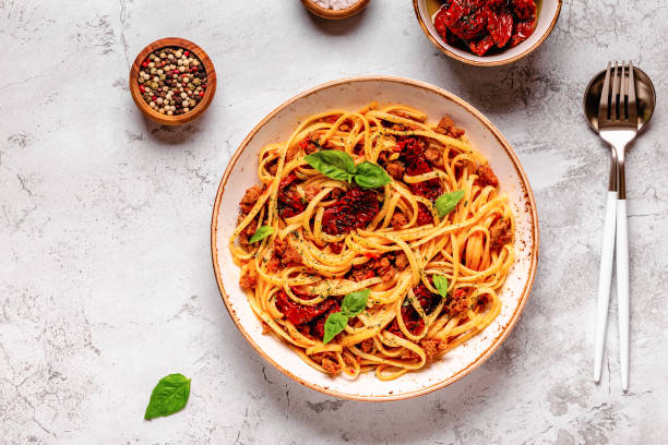 istock Pasta with bolognese sauce and sun-dried tomatoes 1358202745
