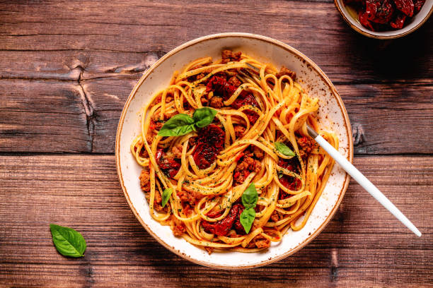 istock Pasta with bolognese sauce and sun-dried tomatoes 1358202917