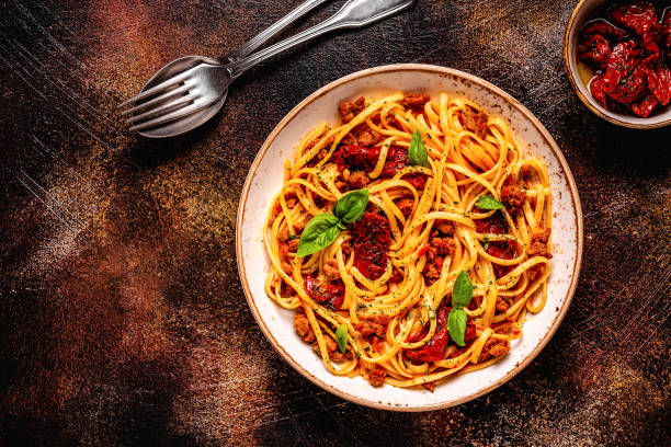 istock Pasta with bolognese sauce and sun-dried tomatoes 1358202978