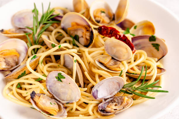 istock Seafood pasta with clams Spaghetti alle Vongole on a light background 1358204118