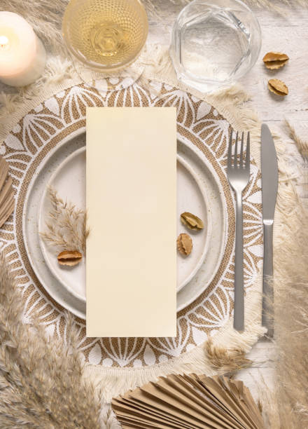istock Boho Wedding Table place with vertical Blank card on plate near pampas grass 1358204694
