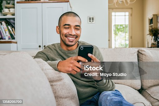 istock Shot of a young man using his smartphone to send text messages 1358205700