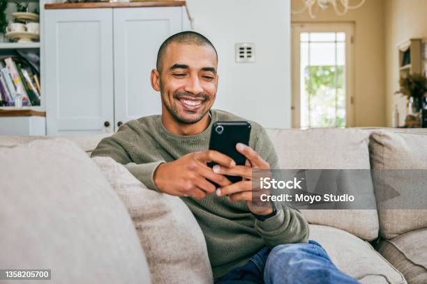 Shot Of A Young Man Using His Smartphone To Send Text Messages Stock Photo - Download Image Now